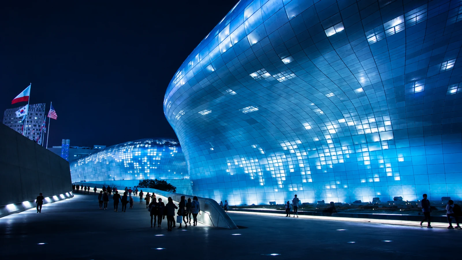 Dongdaemun Design Plaza at night, showing Seoul's futuristic architecture and everyday urban life